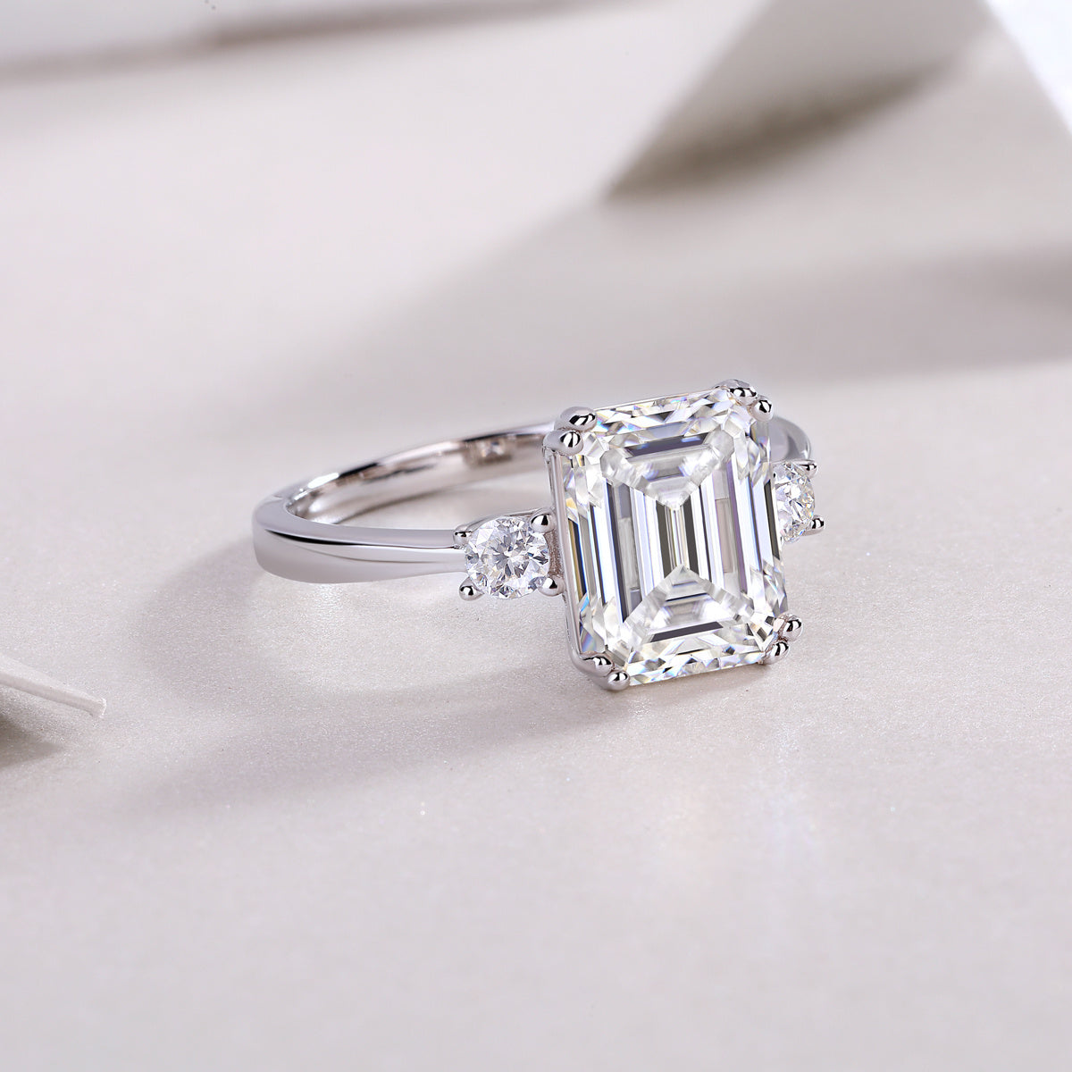 Tree of Life Studio baguette moissanite wedding ring with emerald cut center stone and side diamonds