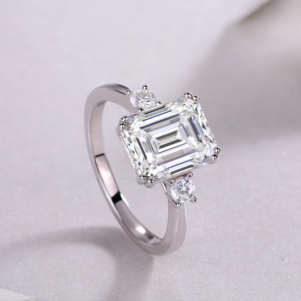 Tree of Life Studio baguette moissanite wedding ring with emerald-cut center stone and round side stones