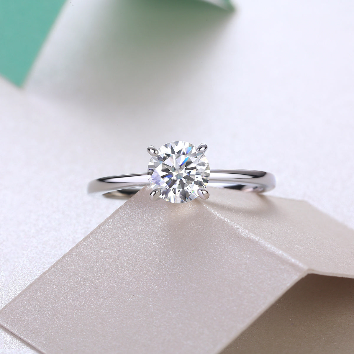 Classic moissanite ring for women by Tree of Life Studio featuring a solitaire round-cut stone on a silver band