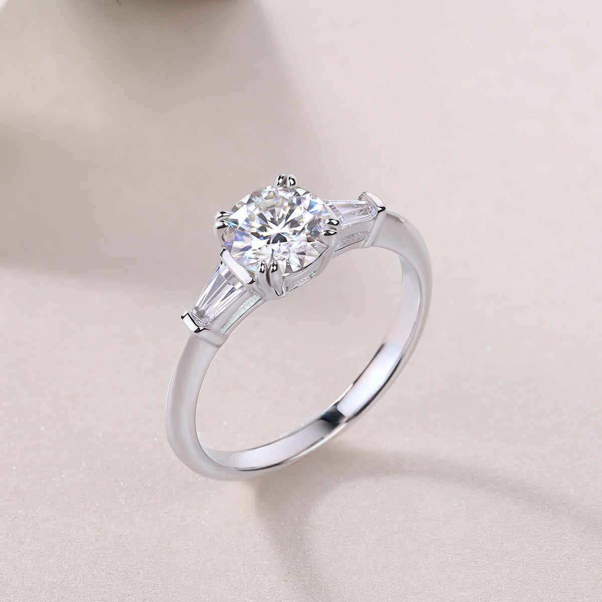 Tree of Life Studio classic Moissanite silver engagement ring with round center stone and tapered baguette accents