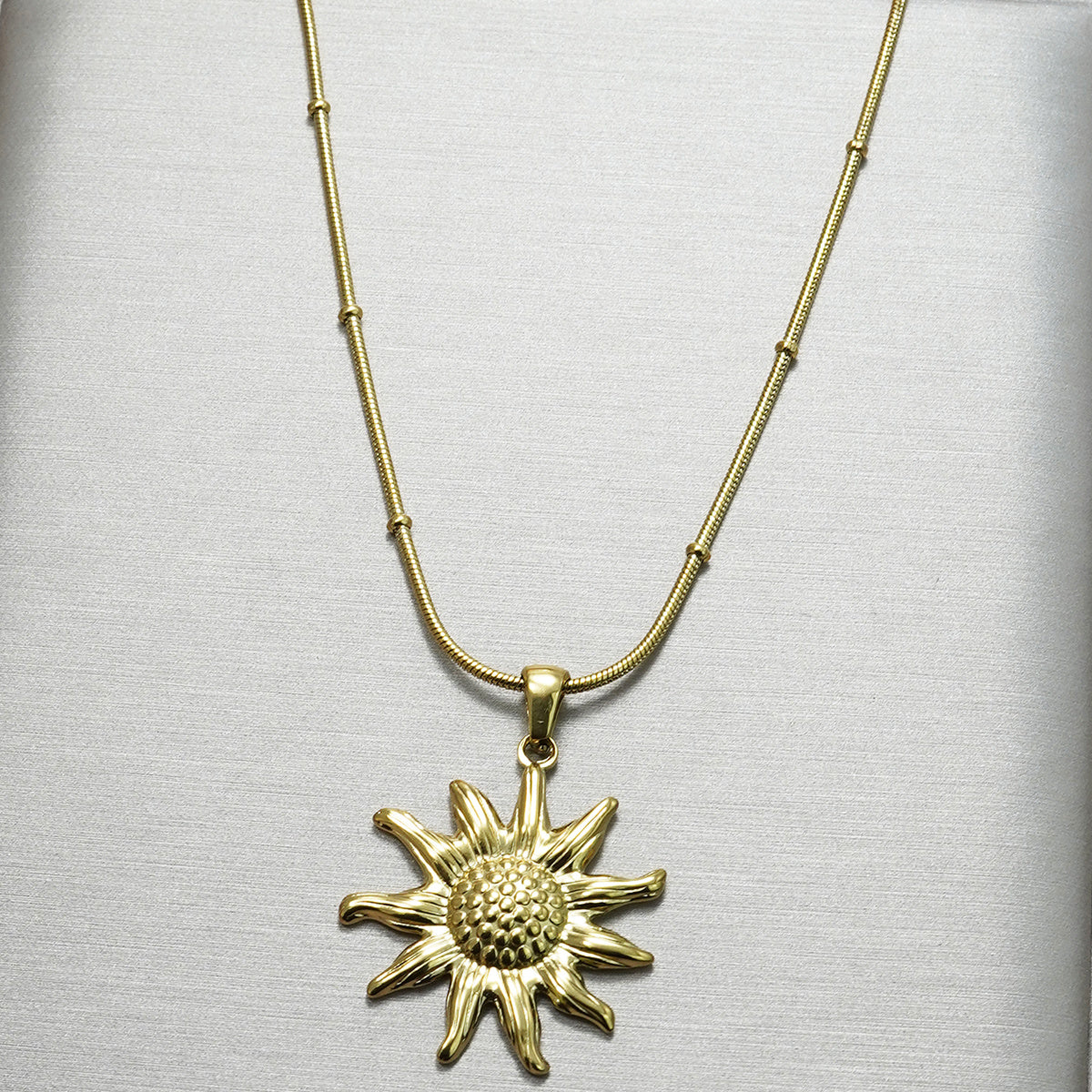 18K gold sun pendant necklace earring set hypoallergenic displayed on a white background from Tree of Life Studio
