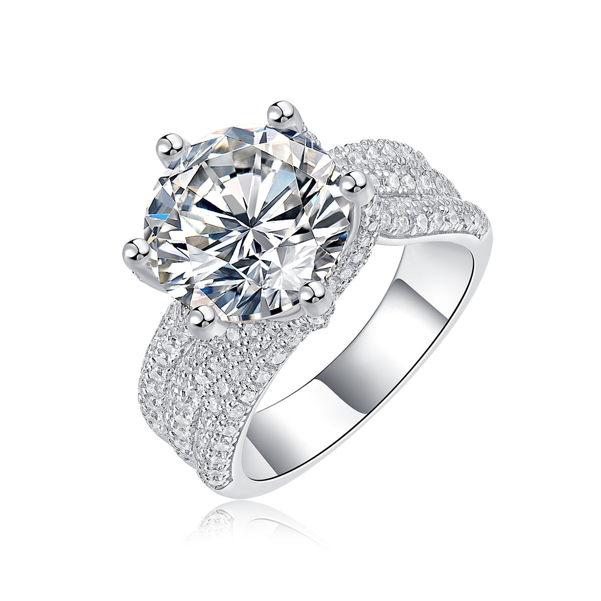 Large silver moissanite ring with a round center stone and pavé diamond band by Tree of Life Studio