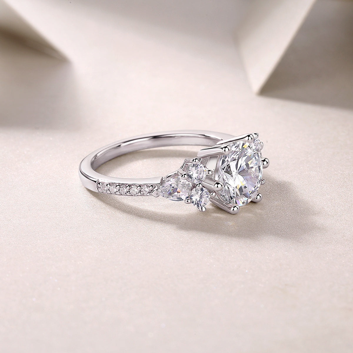 Luxury moissanite engagement ring by Tree of Life Studio with sparkling central stone and side accents