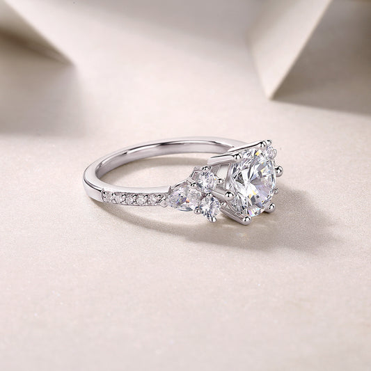 Luxury moissanite engagement ring by Tree of Life Studio with sparkling central stone and side accents