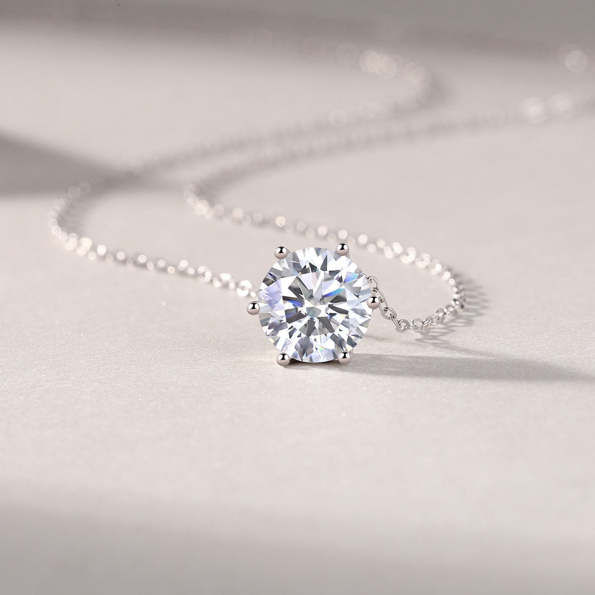 Tree of Life Studio moissanite diamond pendant necklace with a round brilliant cut on a delicate silver chain