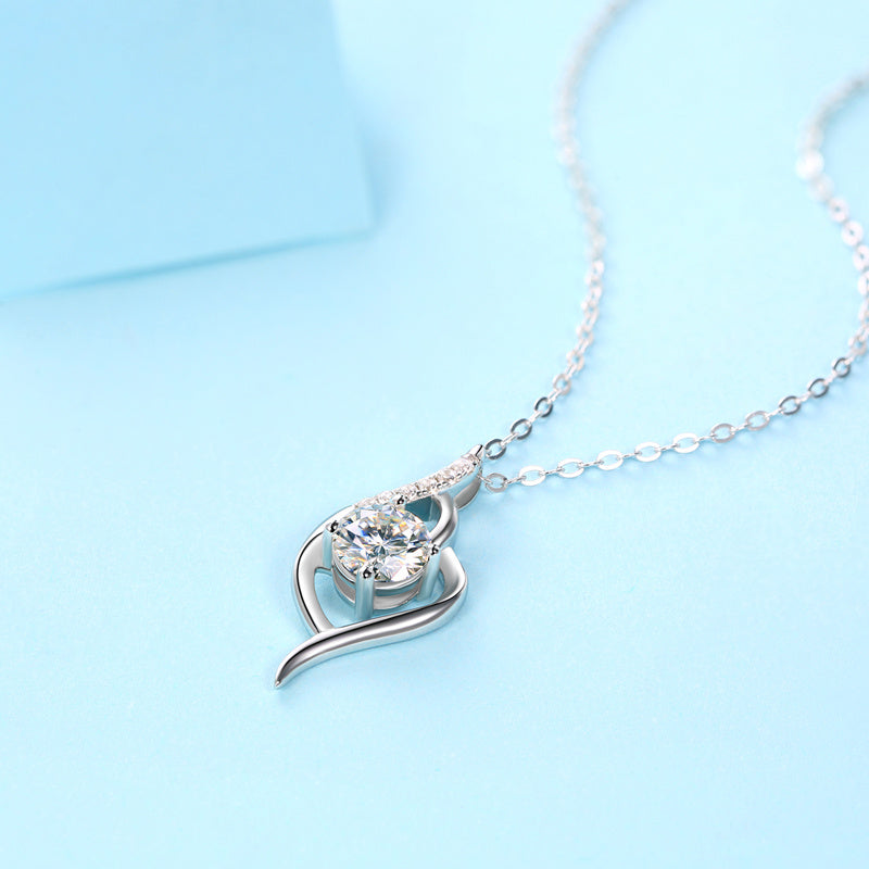 Tree of Life Studio moissanite silver necklace set with a sparkling leaf-shaped pendant on a delicate chain