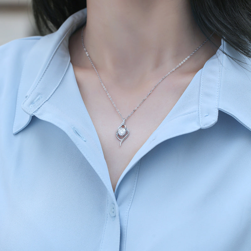 Moissanite silver necklace set from Tree of Life Studio worn on neck with elegant pendant design