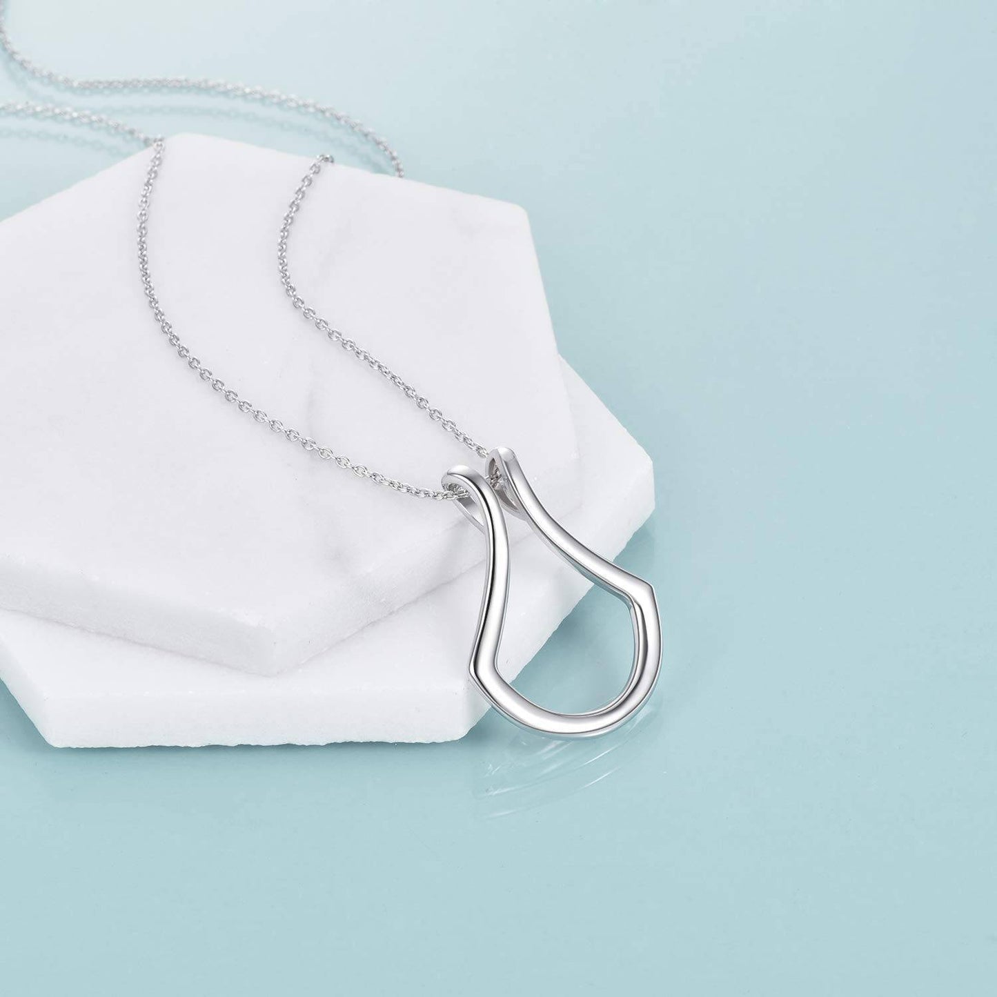Tree of Life Studio silver pendant necklace for holding rings with a sleek modern design