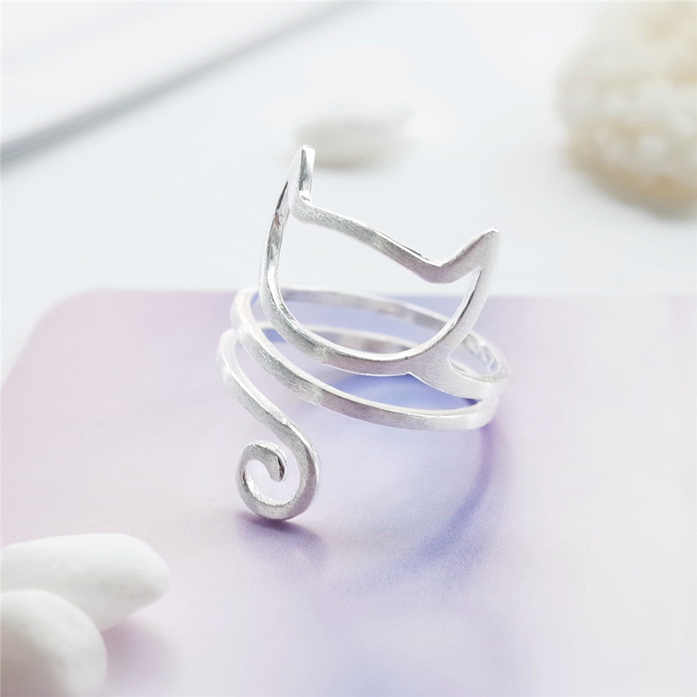 Tree of Life Studio sterling silver cat ring with minimalist cat face and curled tail design