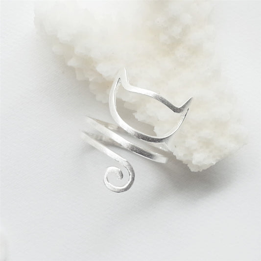 Sterling silver cat ring by Tree of Life Studio with minimalist cat face and curled tail design