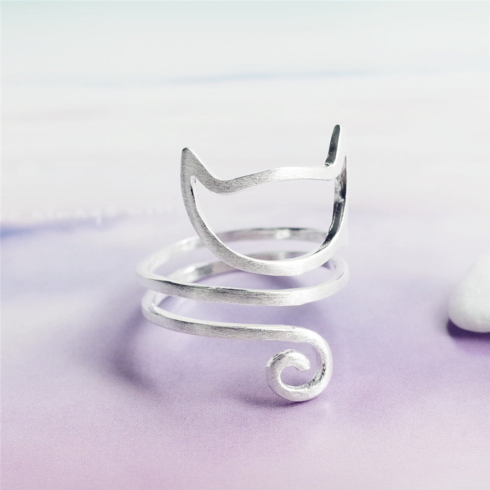 Sterling silver cat ring by Tree of Life Studio with open spiral design and minimalist cat face