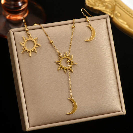 Tree of Life Studio sun and moon jewelry set with gold sun pendant necklace and matching crescent moon earrings
