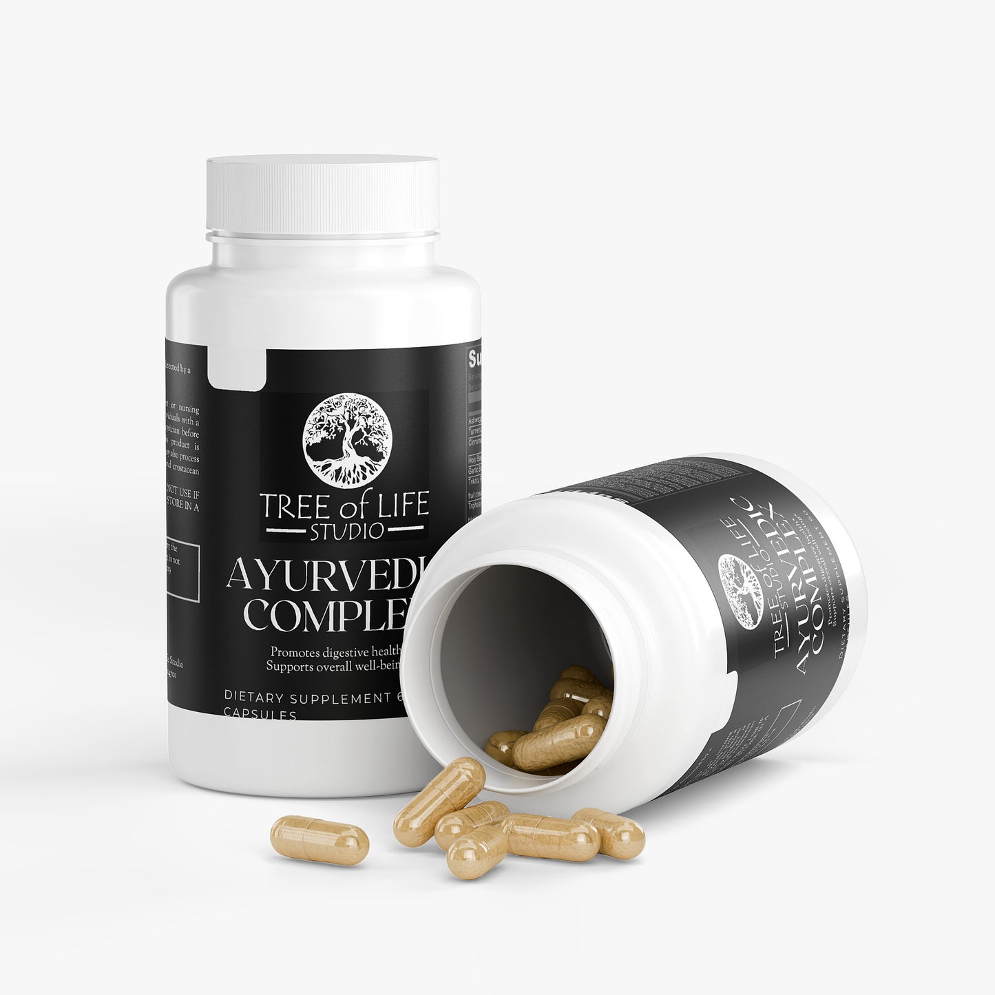 Tree of Life Studio ayurvedic supplement complex bottles with capsules spilling from one bottle