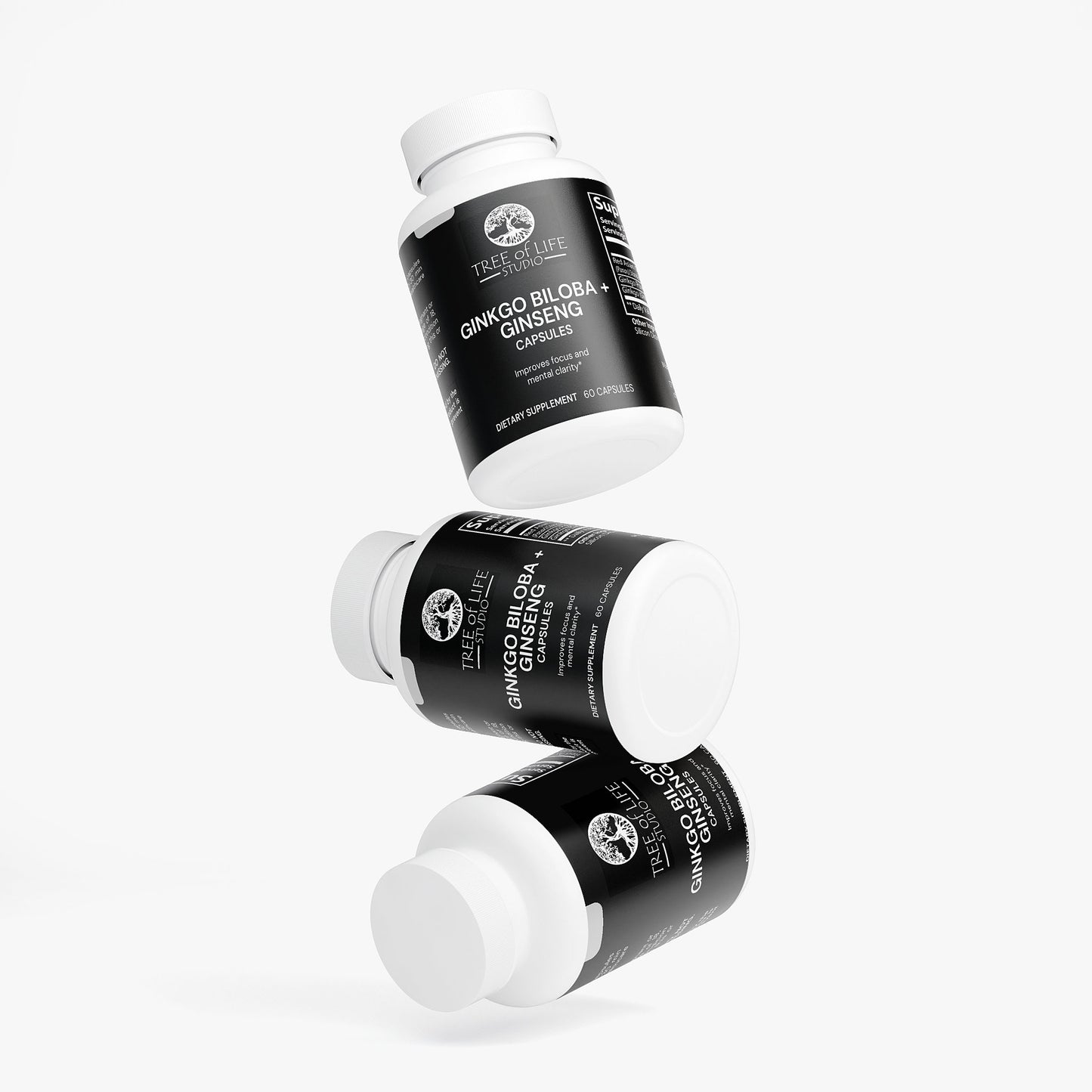 Tree of Life Studio ginkgo biloba and ginseng supplement bottles with black labels floating on white background