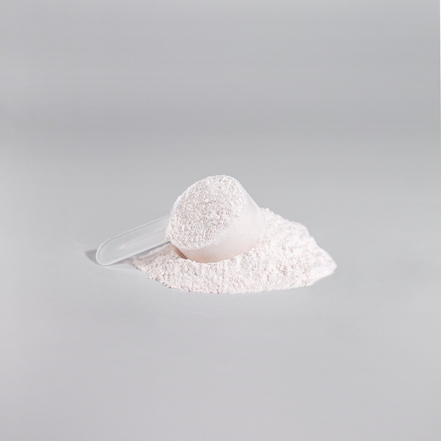 Scoop of Tree of Life Studio nitric shock pre-workout powder in white fine powder form