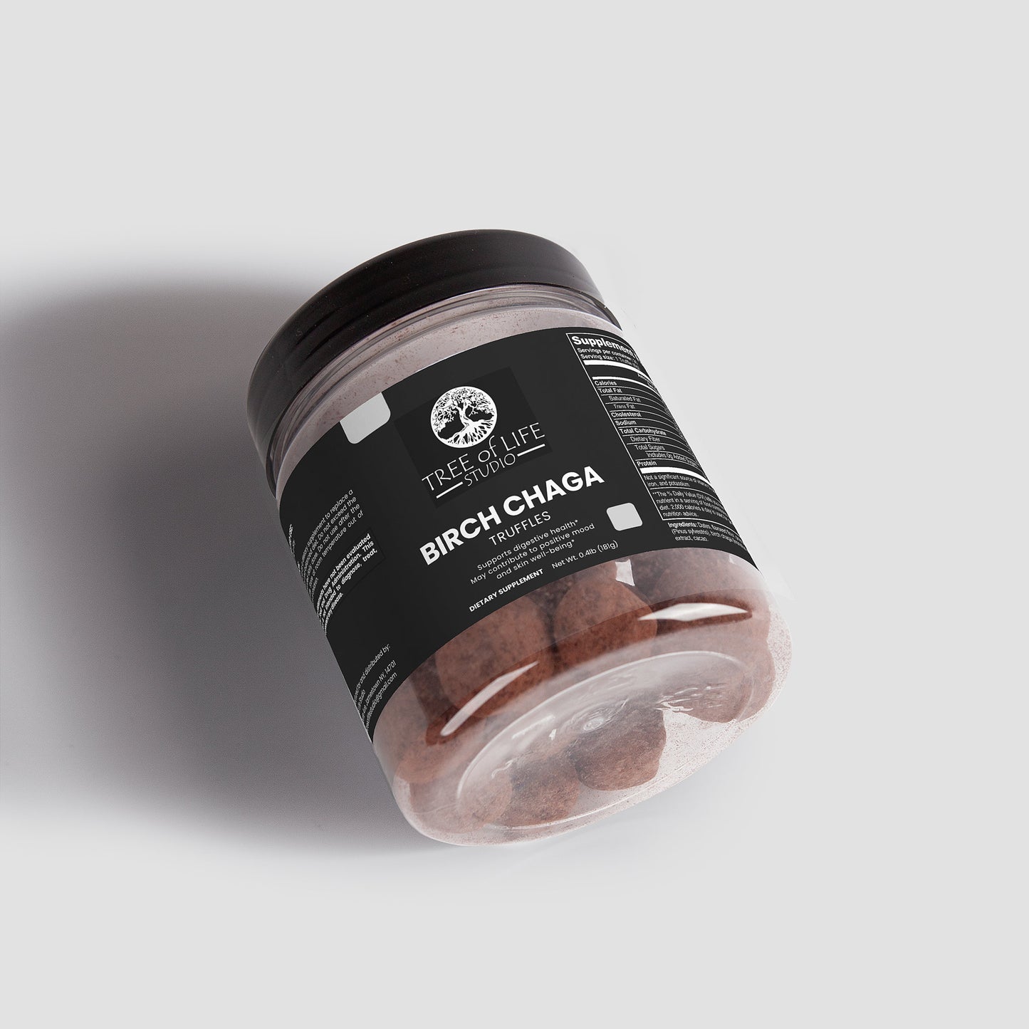 Tree of Life Studio jar of premium chaga mushroom truffles with black label on light background