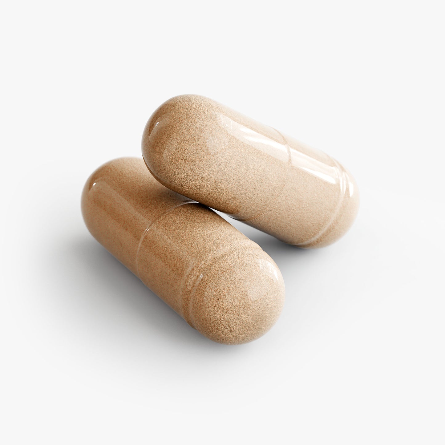 Two beige capsules of premium maca supplement natural extracts by Tree of Life Studio on white background