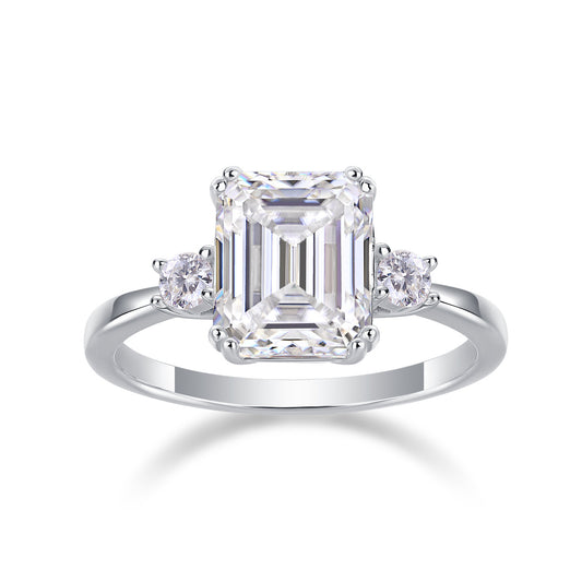 Tree of Life Studio baguette moissanite wedding ring with emerald cut center stone and side round stones