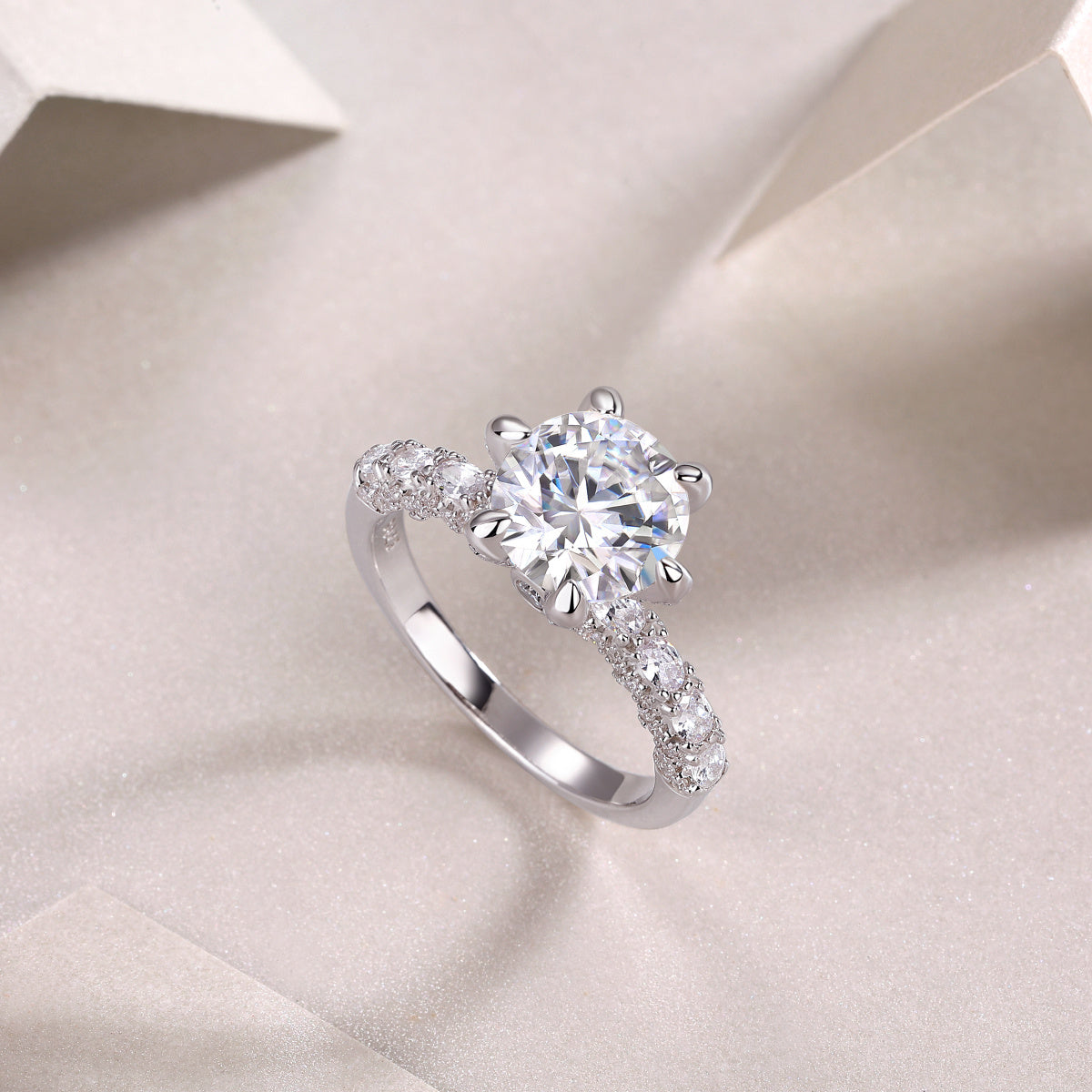 High quality moissanite silver ring with a large center stone and smaller stones on the band