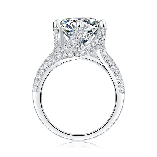 Large silver moissanite ring from Tree of Life Studio with intricate pave diamond detailing