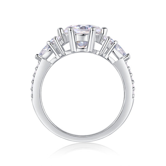 Luxury moissanite engagement ring by Tree of Life Studio with five sparkling stones in silver setting