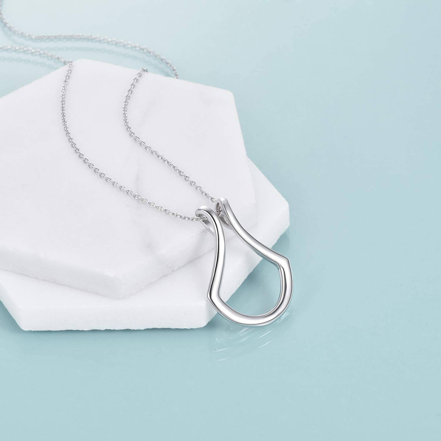 Tree of Life Studio silver pendant necklace for holding rings with a sleek modern design