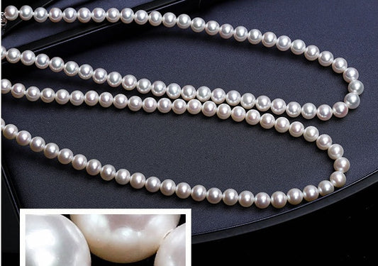Tree of Life Studio spiritual pearl necklace for women featuring lustrous white pearls on black background
