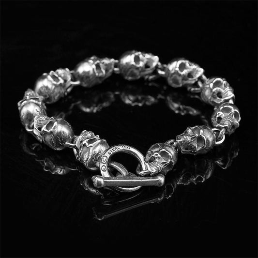 silver spiritual skull charm bracelet with detailed skull beads and toggle clasp