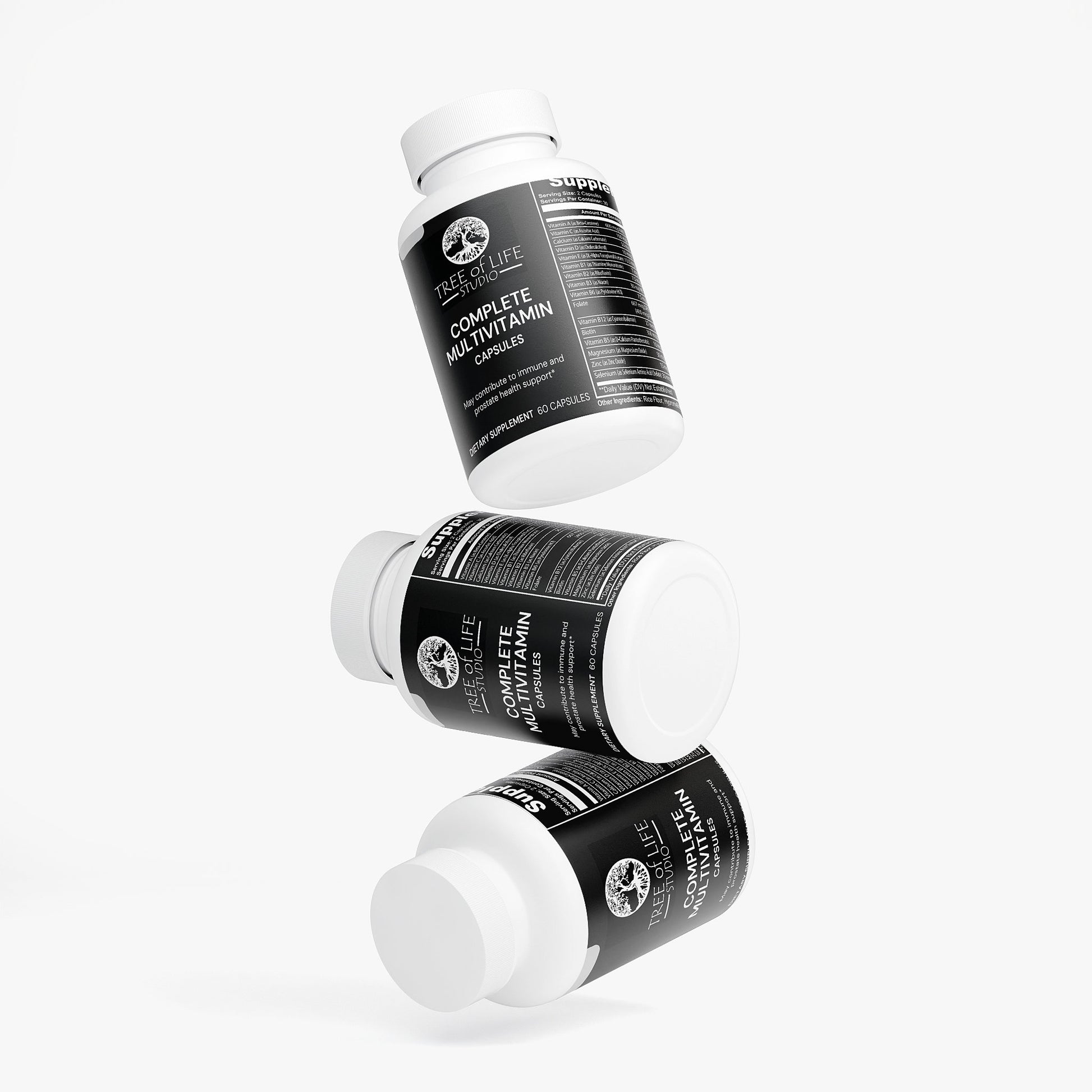 Tree of Life Studio American made multivitamin capsules bottles with black labels stacked on white background