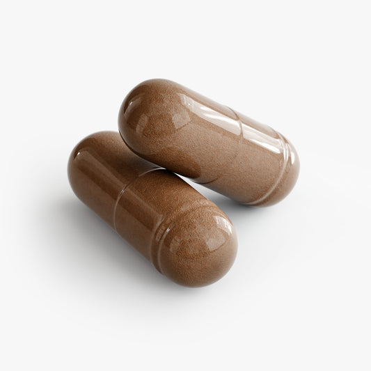 Two brown best prostate support capsules made by Tree of Life Studio on white background