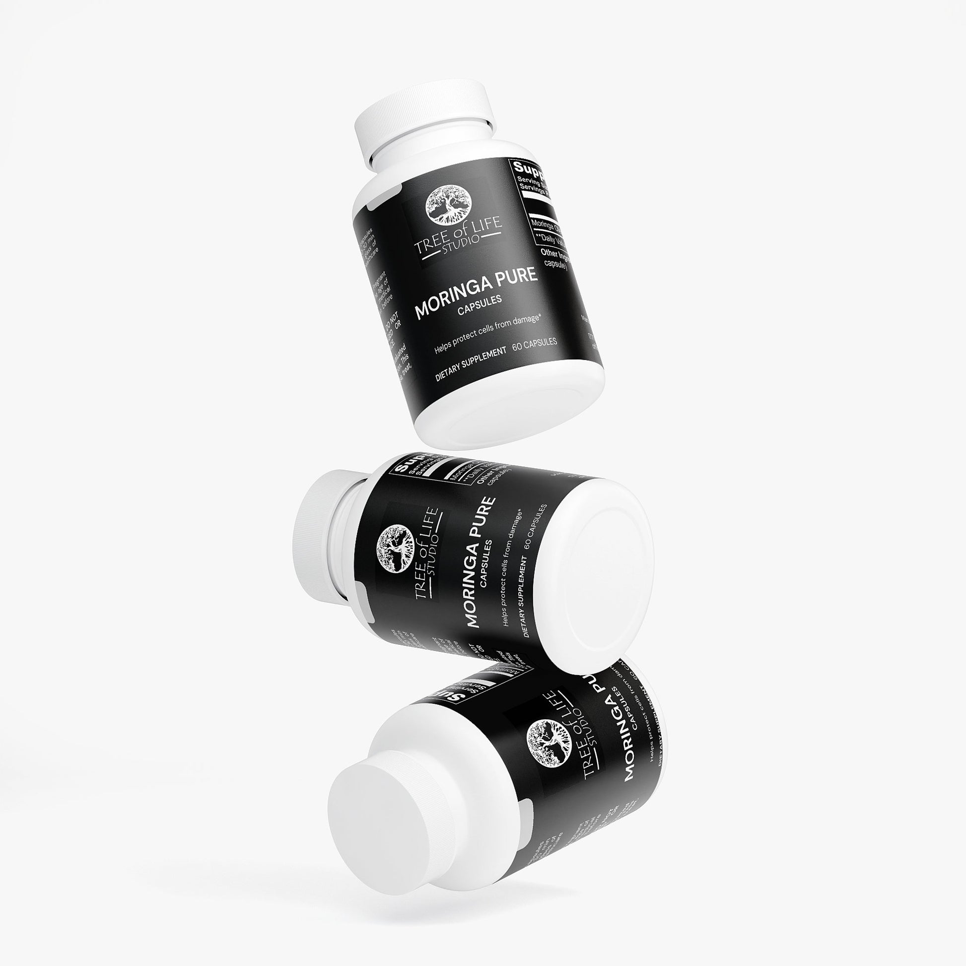 Tree of Life Studio moringa pure supplements made in USA three white bottles with black labels floating on white background