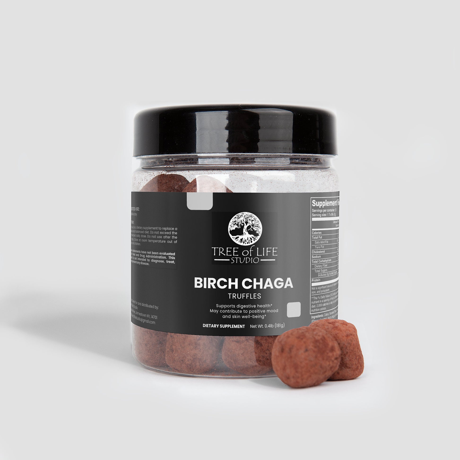 Tree of Life Studio premium chaga mushroom truffles in clear jar with black lid and two truffles outside