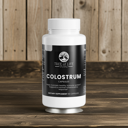 Tree of Life Studio premium colostrum supplement bottle with 60 capsules on wooden surface