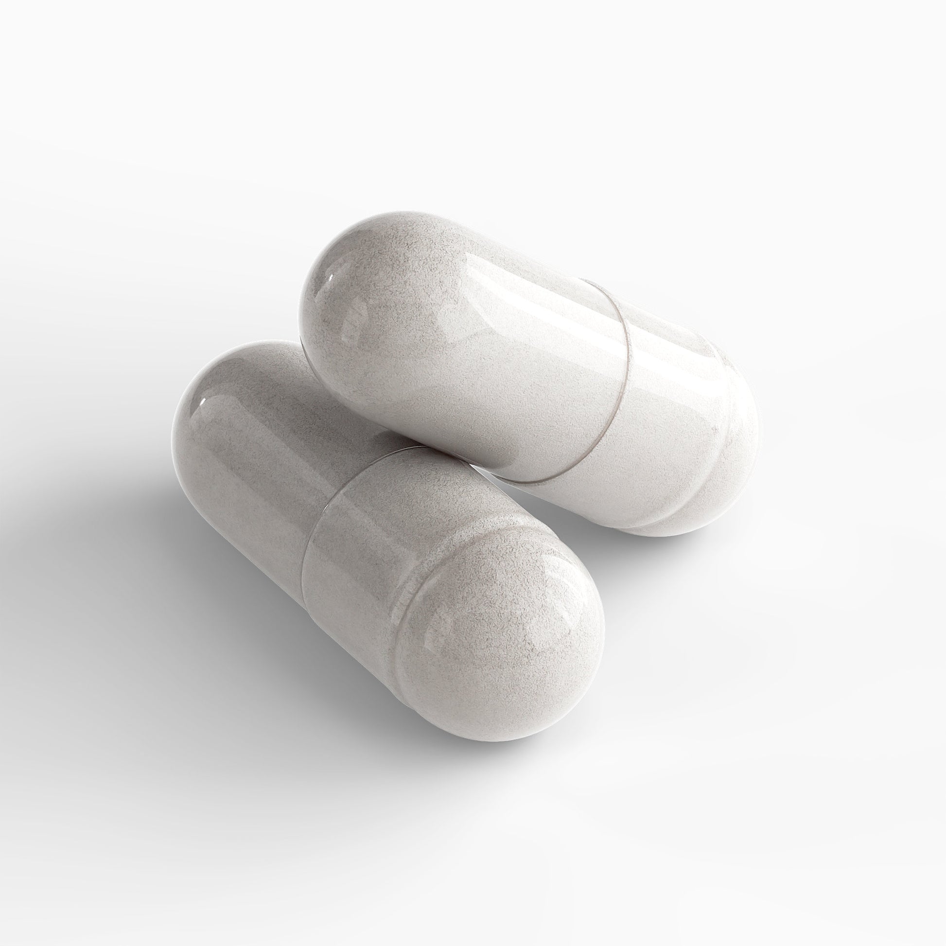 Two clear capsules filled with powder of premium colostrum supplement by Tree of Life Studio