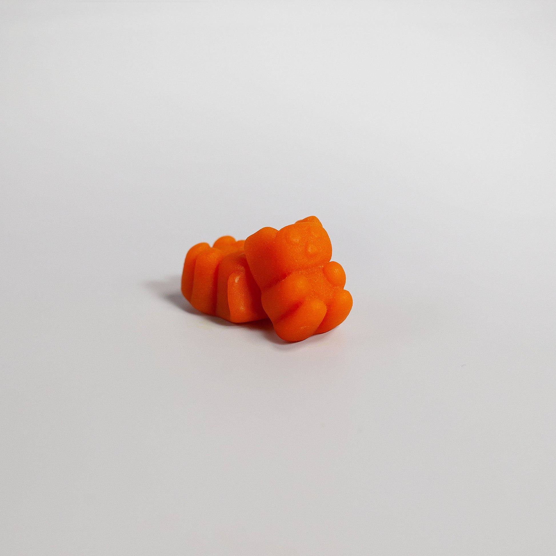 Tree of Life Studio premium turmeric gummies USA shaped like orange bears on white background