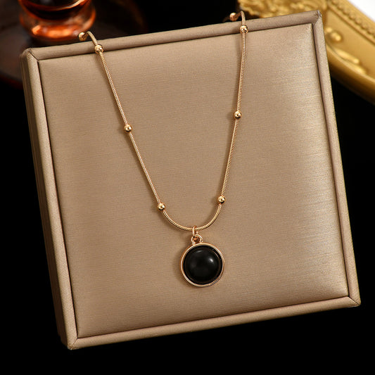 Tree of Life Studio 18k gold plated mood necklace with black circular pendant on gold chain